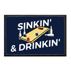 CORNHOLE – SINKIN' & DRINKIN'